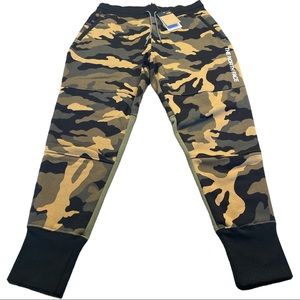 NSE Graphic Pant in Burnt Oliver Green Woods Camo Print